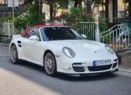 Porsche 911 2010 г. белый фотография